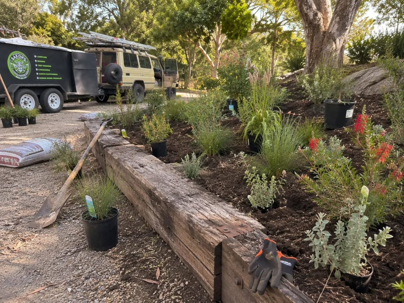 Sleeper retaining bed newly planted with natives