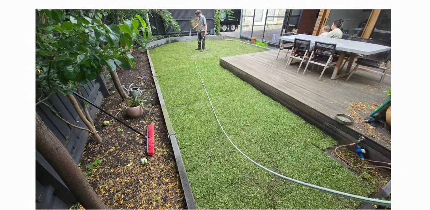 New turf lawn laid beside a timber deck